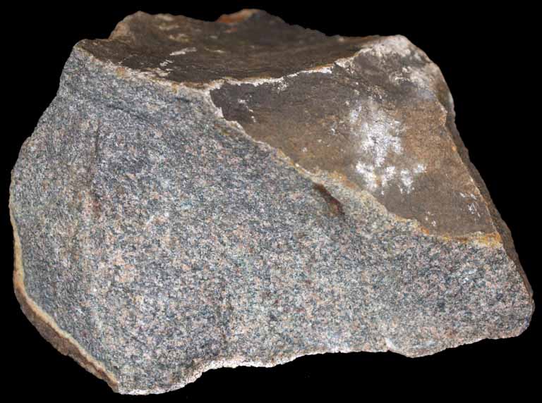 Colour image of gray rock with small black and white spots