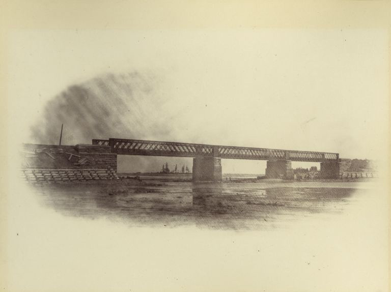 Black and white photograph a train bridge